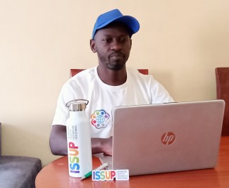 Sammy Ombisa branded with ISSUP logos preparing INEP facilitation at his grassroot office in Nairobi Kenya.