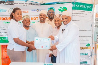 participants with attendance certificates at the end of the training.