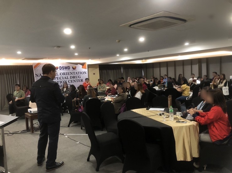 Dr. Paul Lawrence Filomeno stands to the side as he explains his presentation
